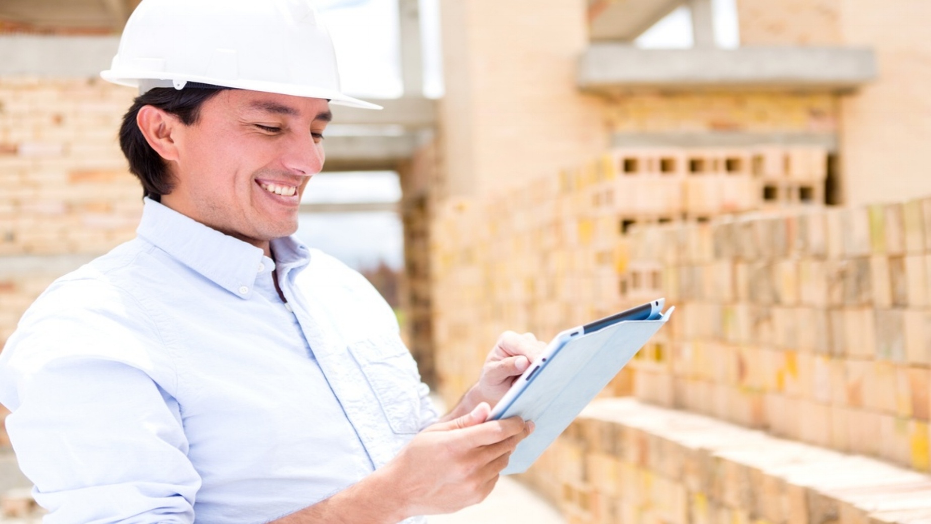 Civil engineer working with a tablet computer-887316-edited.jpeg